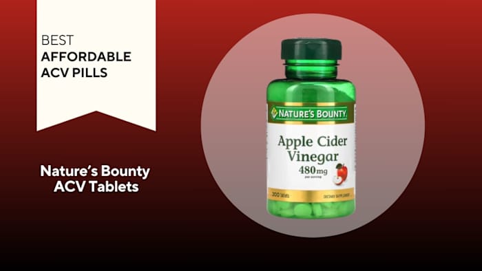 Green pill bottle with a white label that reads "Apple Cider Vinegar" against a red background